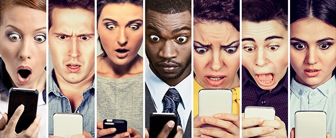 shocked faces looking at smartphones
