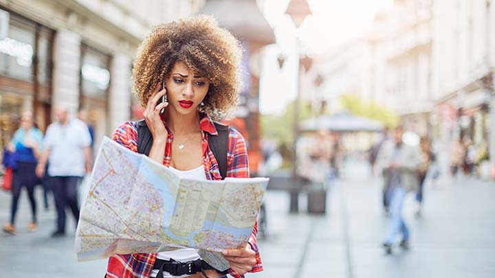 confused woman navigating a map