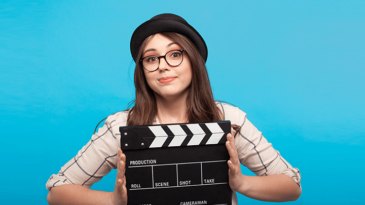 woman holding clapperboard