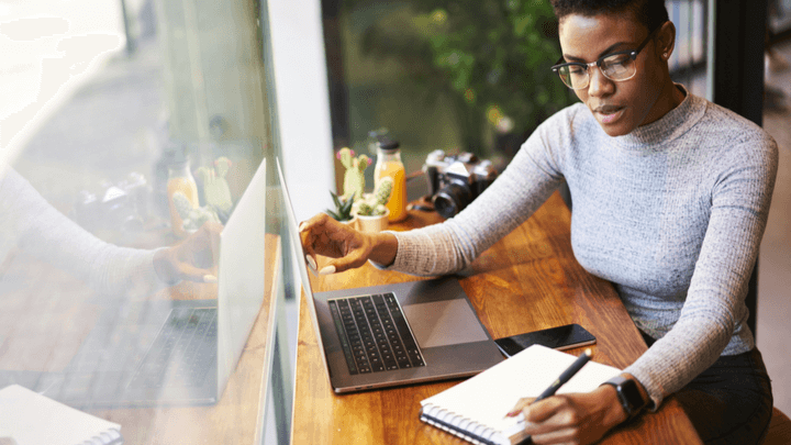 woman making notes in office