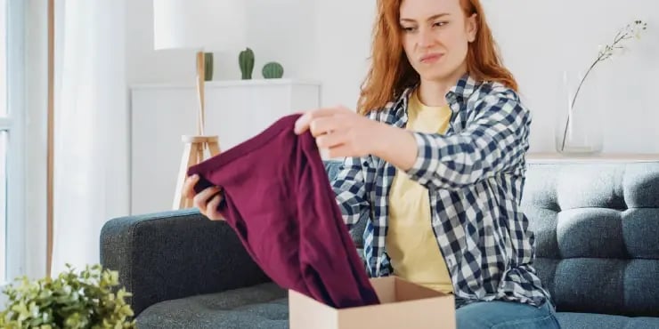 unhappy woman holding new product