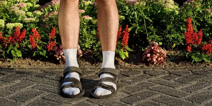 person wearing socks and sandals