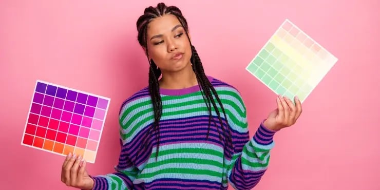 graphic designer choosing between 2 sets of colours