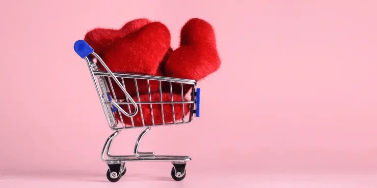 shopping cart holding multiple fuzzy hearts
