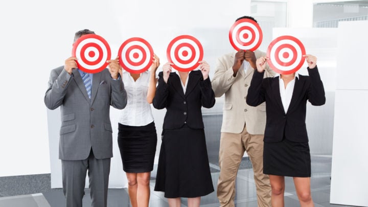 people posing with targets
