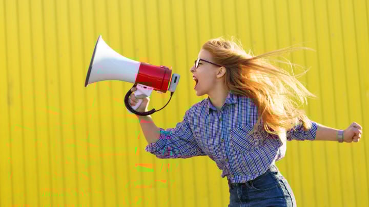 woman screaming into loudspeaker
