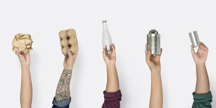 hands holding recyclable products