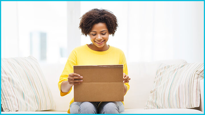 woman opening a box