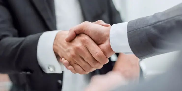 two businessmen shaking hands