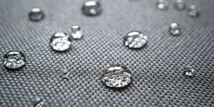 zoomed in image of water droplets on a piece of fabric