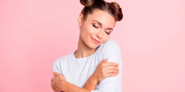 woman hugging herself