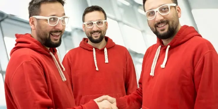 identical triplets wearing the same outfit