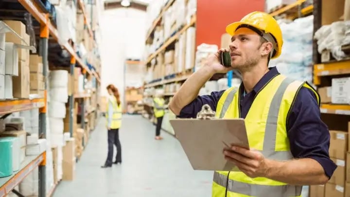 warehouse worker using phone