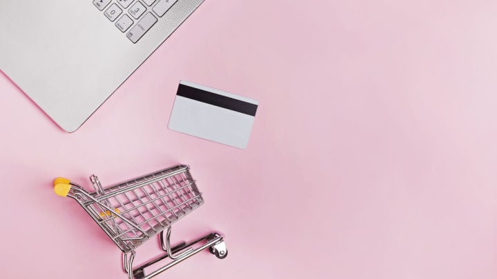 shopping cart with credit card and laptop