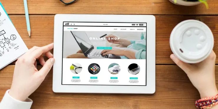 looking at a tablet with an online shop on the screen