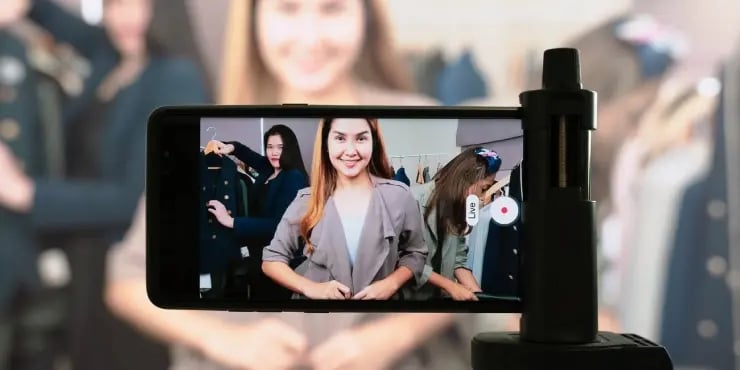 influencer using a smartphone to stream