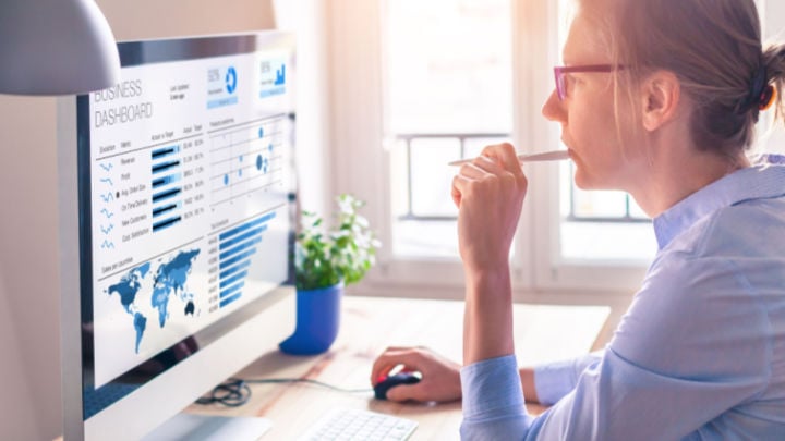 woman studying analytics on computer