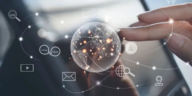 image of hand touching a hologram globe