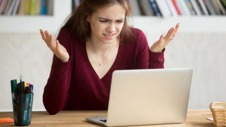 woman confused at her computer