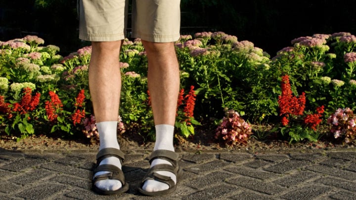 man wearing sandals and socks