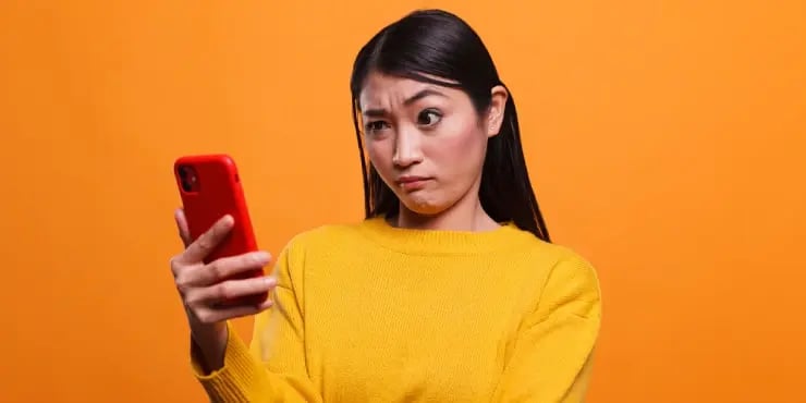 confused person on smart phone