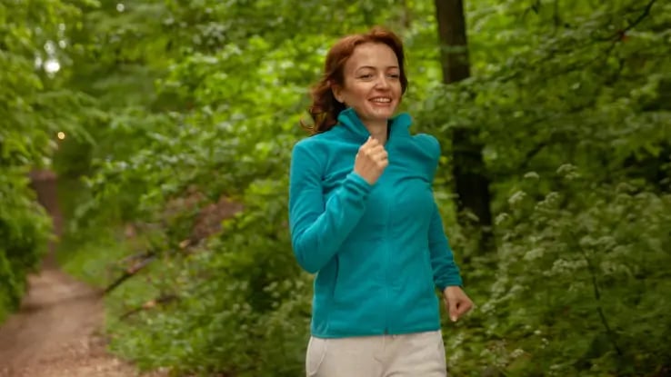 mother jogging in woods