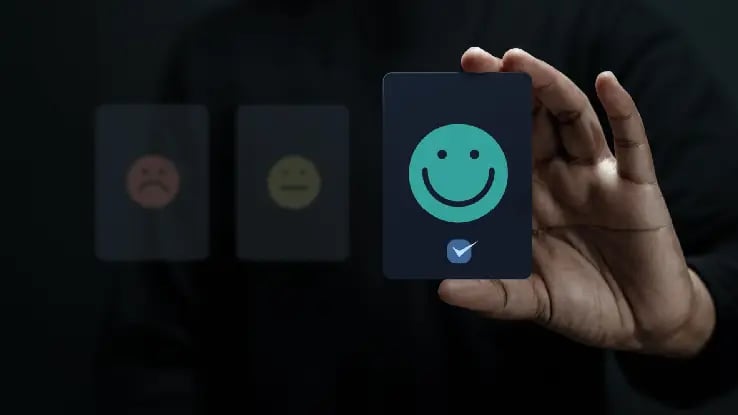 man choosing a happy face card