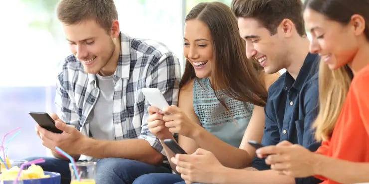 people smiling at their devices