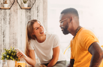 man and woman having a chat while looking at her phone